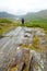 Hiker admiring the beauty of Killarney National Park at Lady`s View viewpoint. One of most impressive overlooks on the Ring of