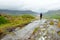 Hiker admiring the beauty of Killarney National Park at Lady`s View viewpoint. One of most impressive overlooks on the Ring of