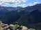 A hiker admiring the glorious view of the Rocky Mountains after completing the Sulphur Skyline Trail outside of Jasper National Pa