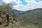 A hiker against a volcanic crater, Mount Suswa