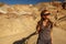 A hiker in the Artist`s Palette landmark place in Death Valley National Park, Geology, sand