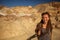 A hiker in the Artist`s Palette landmark place in Death Valley National Park, Geology, sand