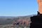 Hiker atop the cliff enjoying the scenic view