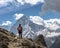 Hiker backdrop of majestic Himalayan mountains. Trekking to Everest. Nepal.
