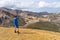 Hiker with backpack in the Landmannalaugar Valley. Iceland. Colorful mountains on the Laugavegur hiking trail. The