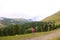 Hiker with backpack looking at view alpine Dolomites, Italy, Europe