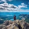 Hiker with backpack standing on the edge of a cliff, Hiker at the summit of a mountain overlooking a stunning view