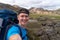 Hiker with backpack taking selfie in the Landmannalaugar Valley. Iceland. Colorful mountains on the Laugavegur hiking