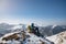 Hiker with backpack at the top of a mountain. Beautifull winter landscape.