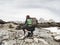 Hiker with backpack traveling in spring Dolomiti