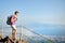 Hiker with backpack on Vesuvius looking panorama