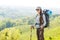 Hiker backpacker girl enjoing journey in mountains