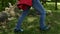 Hiker boots walking on forest edge jumping over fallen tree