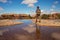 Hiker in Canyonlands National park, needles in the sky, in Utah, USA