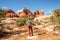 Hiker in Canyonlands National park, needles in the sky, in Utah, USA