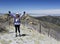 A Hiker Celebrates Reaching the Summit of a Mountain