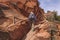 Hiker on a chain assisted trail