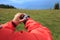 Hiker checking the altimeter on sports watch at mountain peak