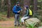 Hiker couple interacting with each other in forest