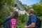 Hiker couple visiting the Predjama Castle inside the Postojna Cave in Slovenia