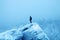 Hiker on edge of cliff and panorama of snow-covered forest