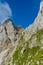 Hiker at Ellmauer Halt, Wilder Kaiser mountains of Austria - close to Gruttenhuette, Going, Tyrol, Austria - Hiking in the Alps of
