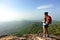 Hiker enjoy the view at sunset mountain peak