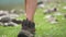 Hiker girl foots in nature with boots