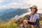 Hiker girl with happy on Phu Chi Fa Mountain