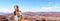 Hiker girl hiking alone with backpack on trek trail walk hiking poles in Grand Canyon National Park banner panorama