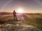 Hiker girl stay in strong Sun rays with many flares around her body