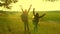 Hiker Girls teamwork. free traveler girls raise their hands up, celebrating victory and enjoying the scenery, in sun
