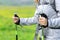 Hiker hands using poles to walk in the mountain