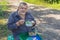 Hiker having lunch on a roadside at summer season