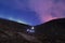 Hiker headlamps long exposure volcano aurora