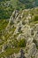 Hiker jumping and running between rocks at Jelasnica gorge