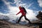 Hiker jumps on the rock near Everest in Nepal