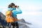 Hiker looking in binoculars