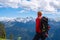 Hiker looking at clouds floating in blue sky