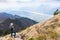 Hiker looking from Monte Chiampon to Friuli-Venezia Giulia