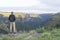 Hiker looking at view of mountain gorge