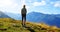 Hiker looks at the alpine landscape - Switzerland.