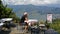 A hiker lounging on a terrace of a pokhara bar enjoying the views of phewa lake