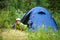 Hiker lying in camp tent