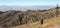 A Hiker Makes Her Way Up a Mountain Slope