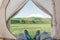 Hiker man lying in a tent and enjoying view of mountain Elbrus, pov.