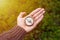 Hiker man searching direction with a compass in the forest. View of hand.