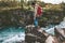 Hiker man standing on cliff alone active lifestyle adventure extreme vacations