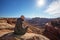 Hiker meets sunset at Grand view point in Canyonlands National p