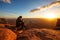 Hiker meets sunset at Grand view point in Canyonlands National park in Utah, USA